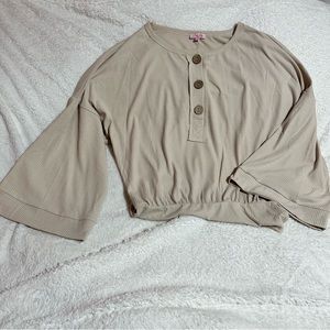 Cream, batwing bodysuit.